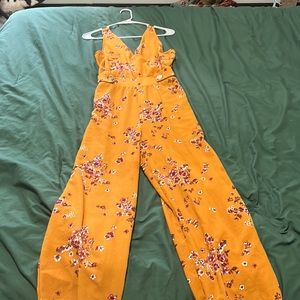 Mustard/ yellow jumpsuit with white and dark pink Sakuras.
